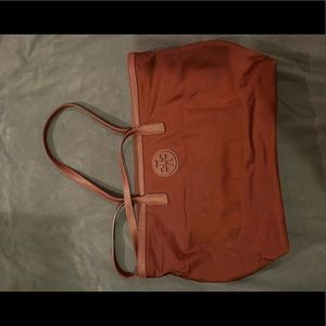 I am selling a red/orange Tory Burch tote bag.